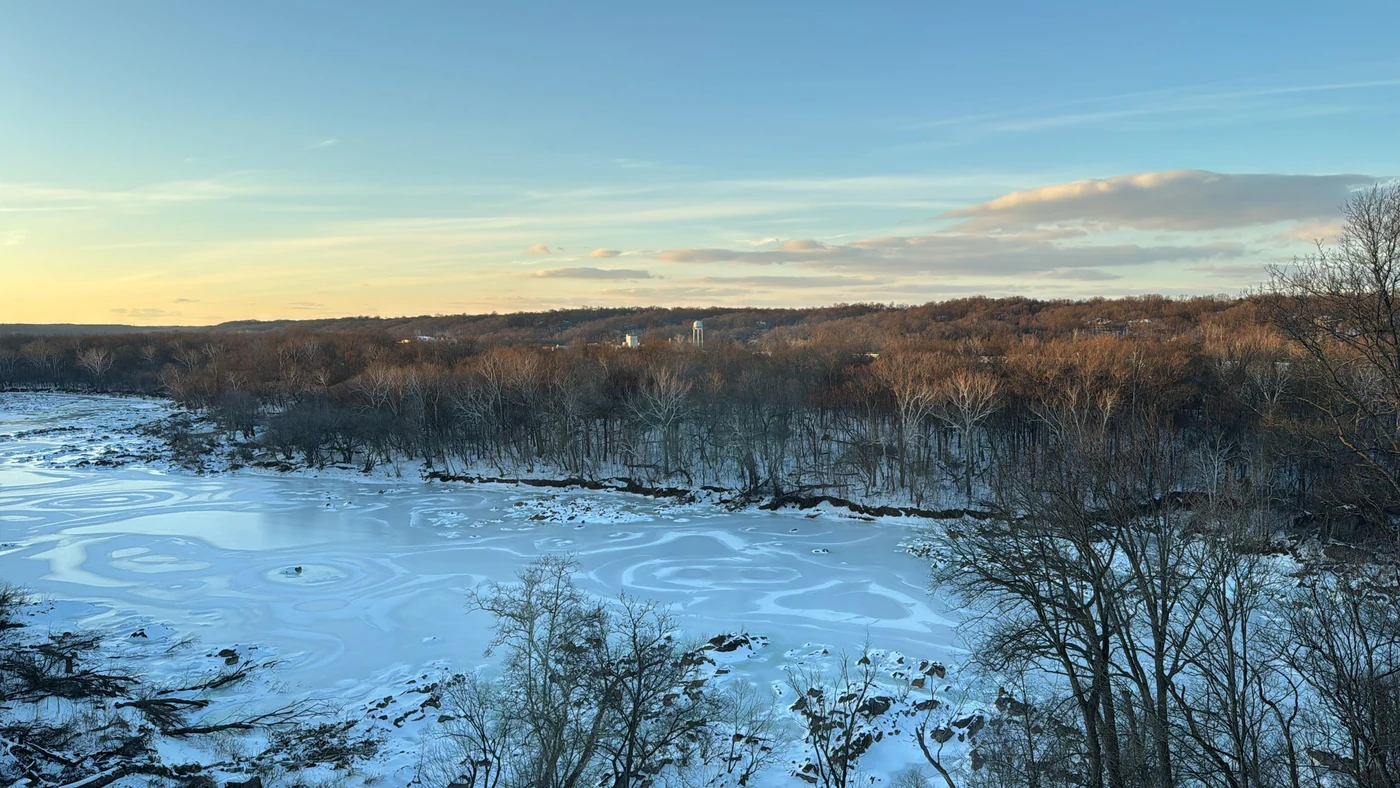 Snow and ice along the Potomac beneath a clear winter sky.