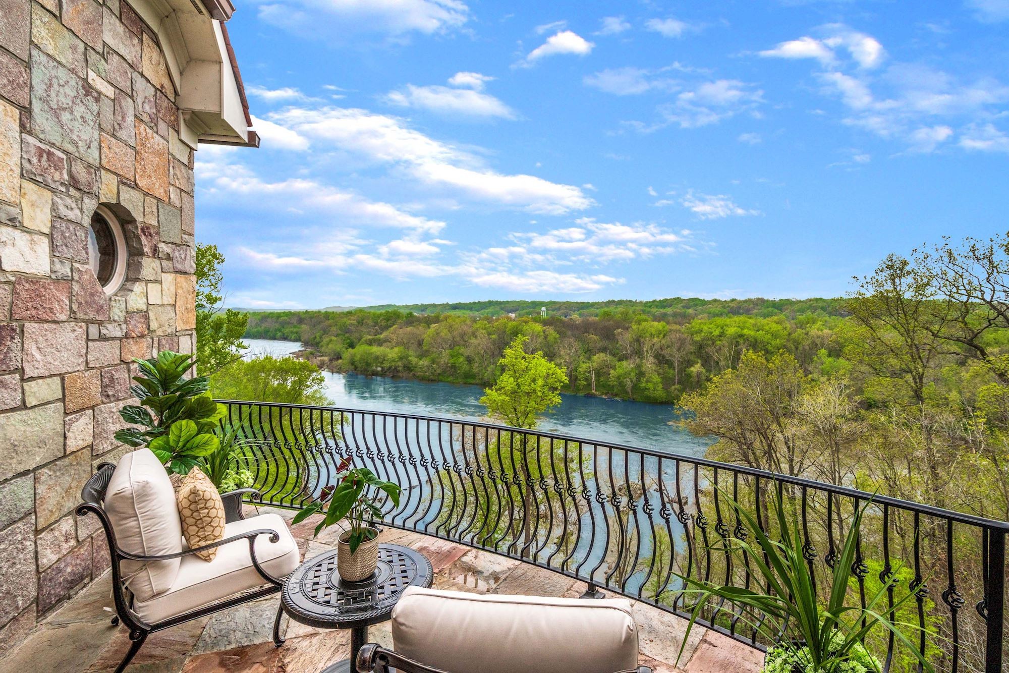 Covered balcony with wrought iron railing