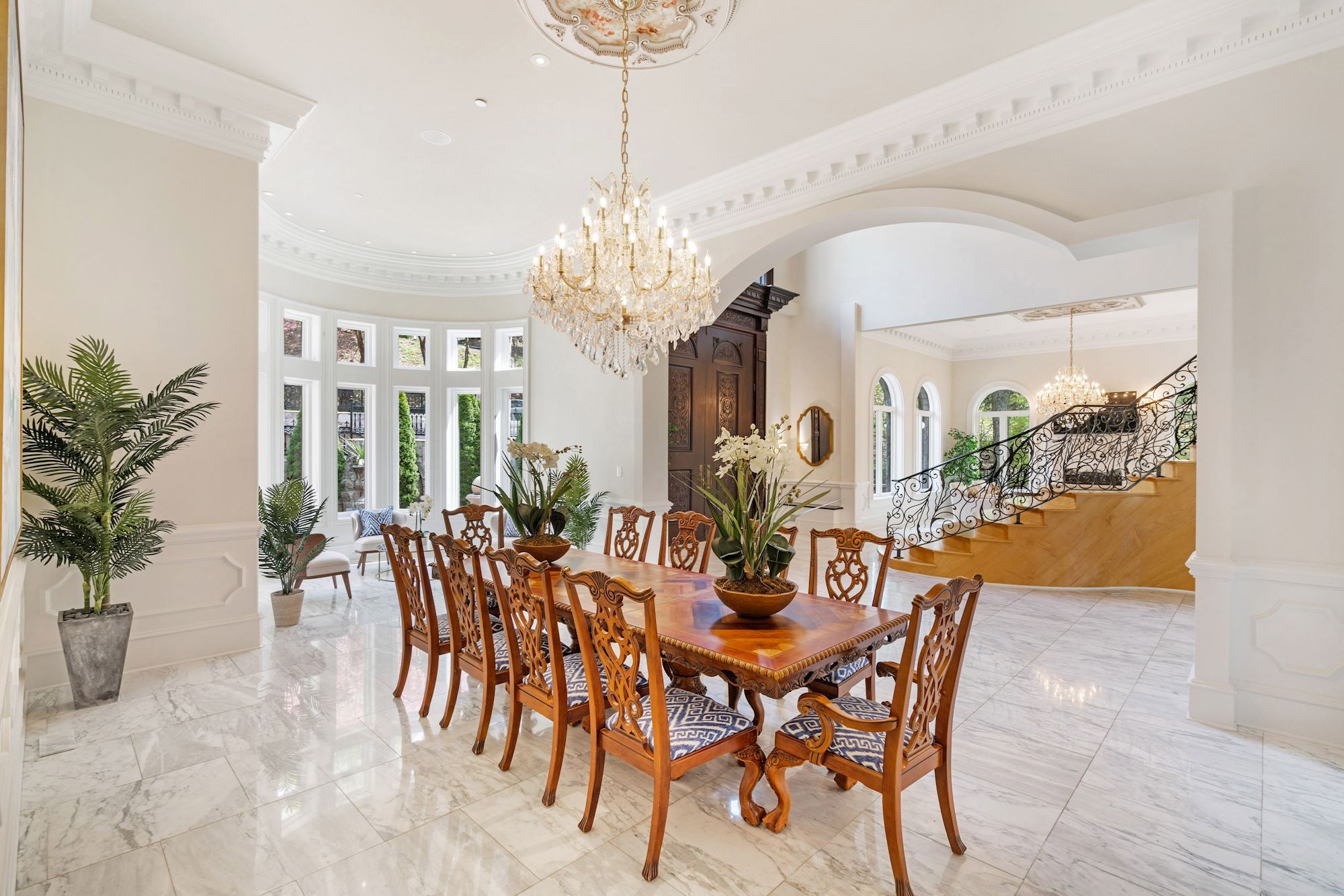 Formal dining room with chandelier and window alcove