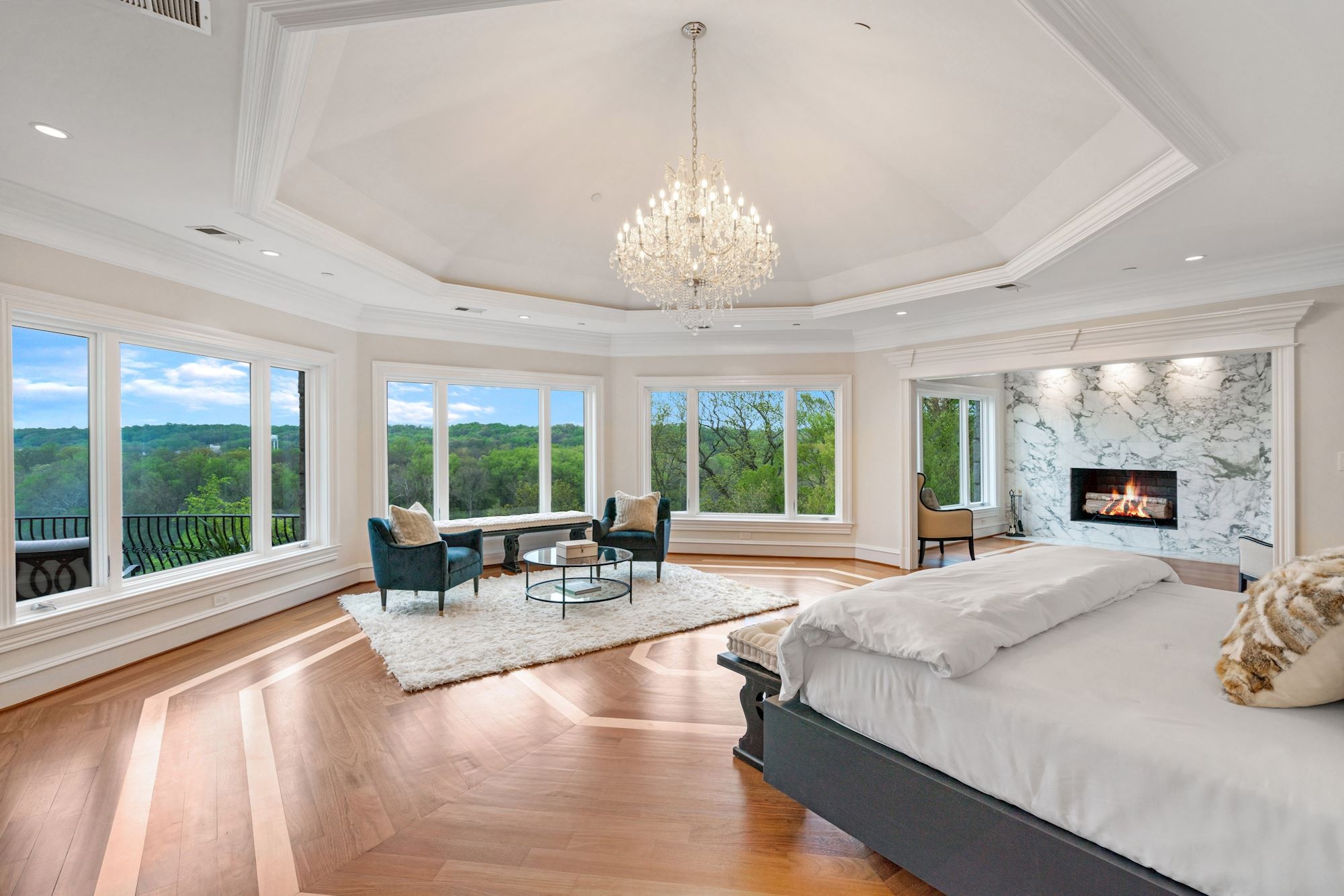 Primary suite with fireplace and river-facing windows