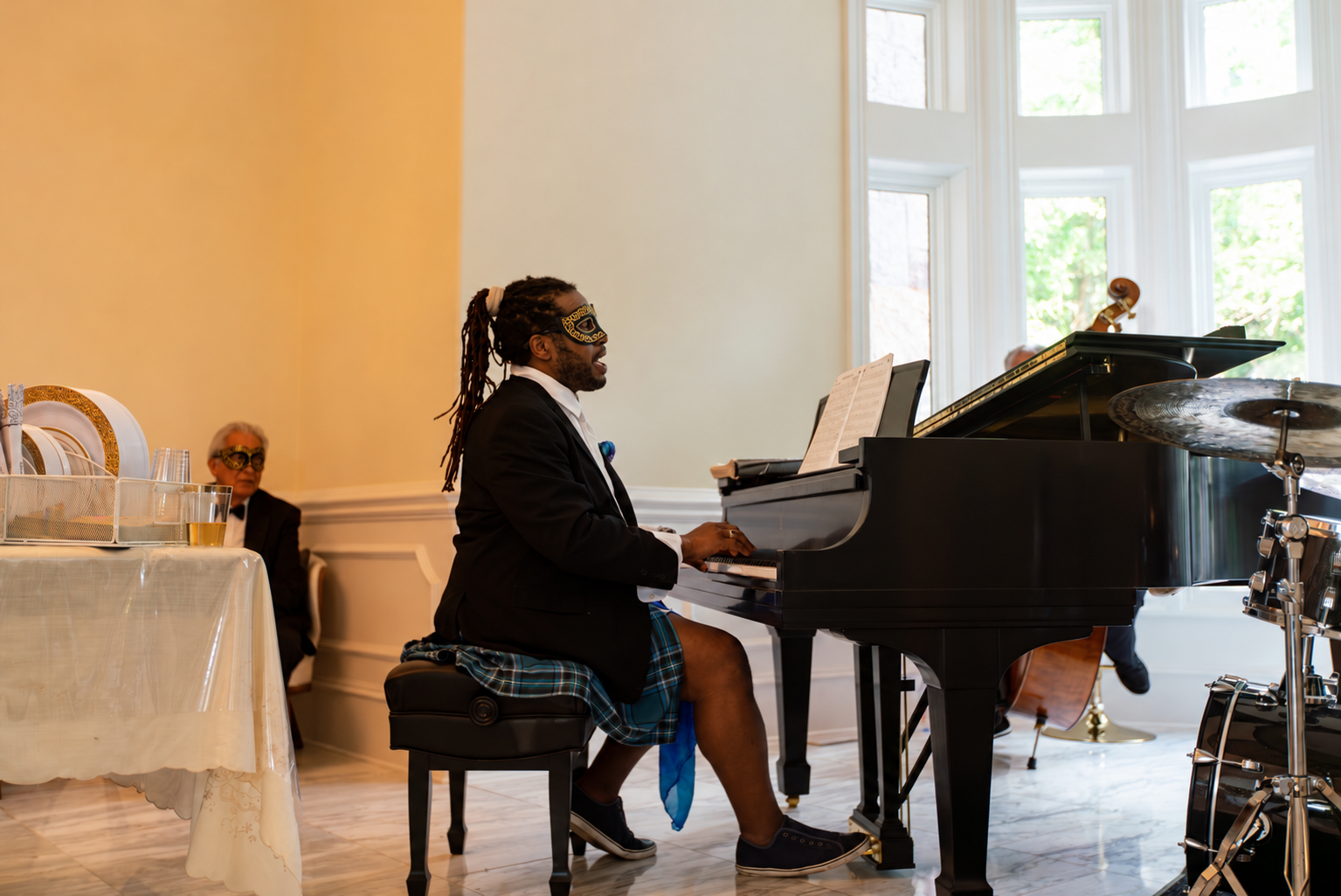 Pianist performing in the window alcove