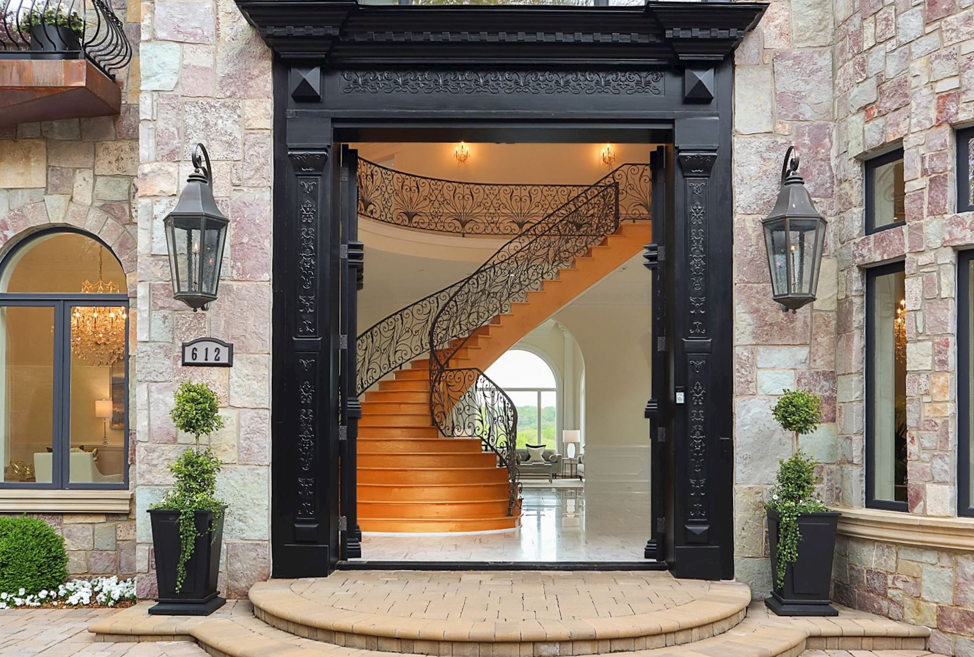 The carved mahogany entry, open.