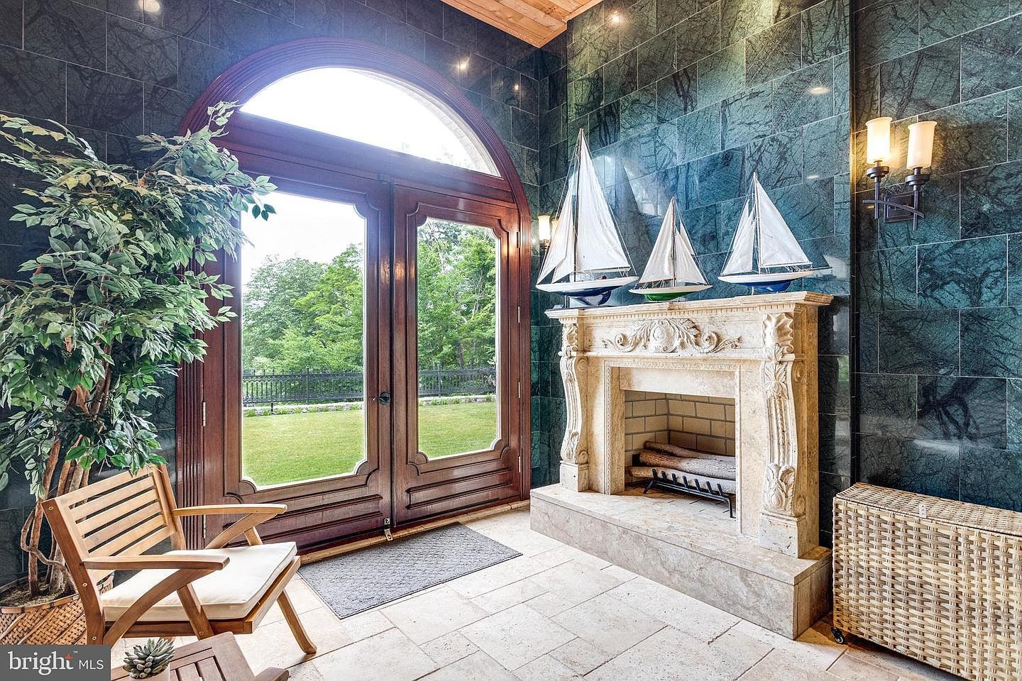 A fireplace at the edge of the pool room.