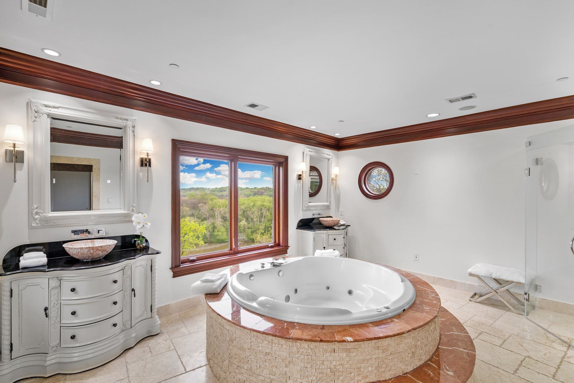 The bath in the Shakespeare Suite, a round tub and a round window.
